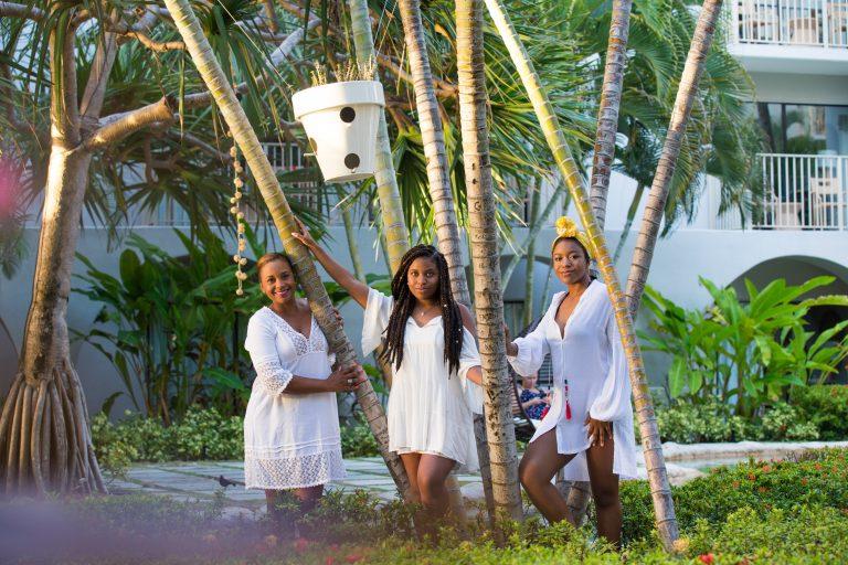 Three African American women in a tropical forest - hair style and care for any weather