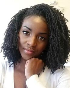 African American woman with shoulder-length sisterlocs - your guide to styling and maintaining locs
