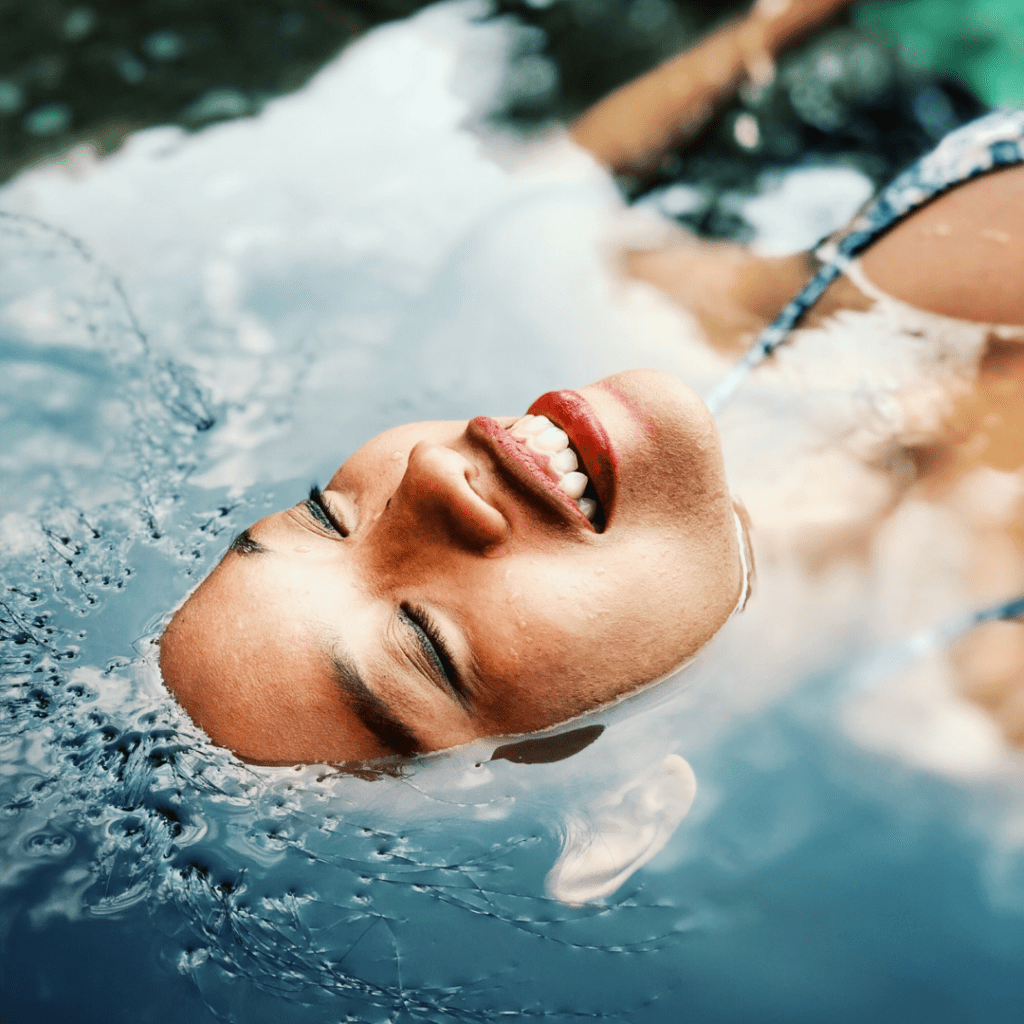 Woman with hair submerged in water