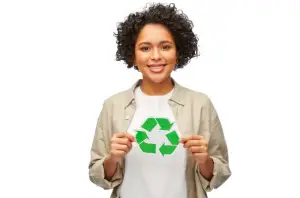 woman of color with black curly hair holding a recycle sign